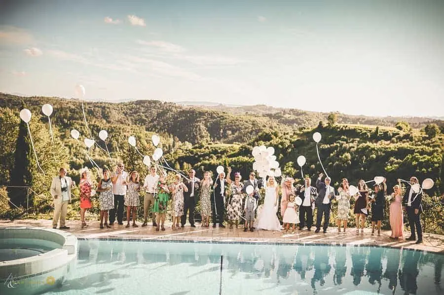 Wedding party at the panoramic pool at Borgo Bucciano, Tuscany