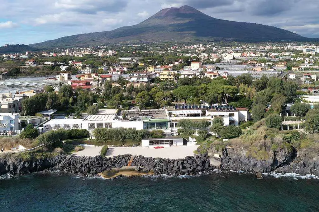A villa above the sea with Vesuvius behind