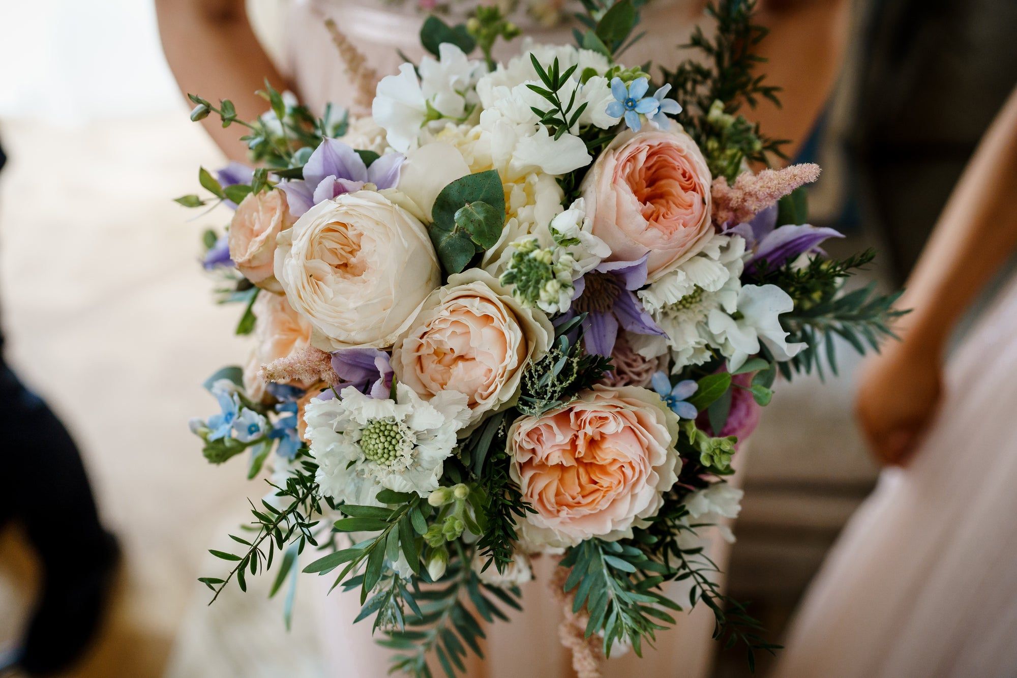 A bridal bouquet in peony and garden rose