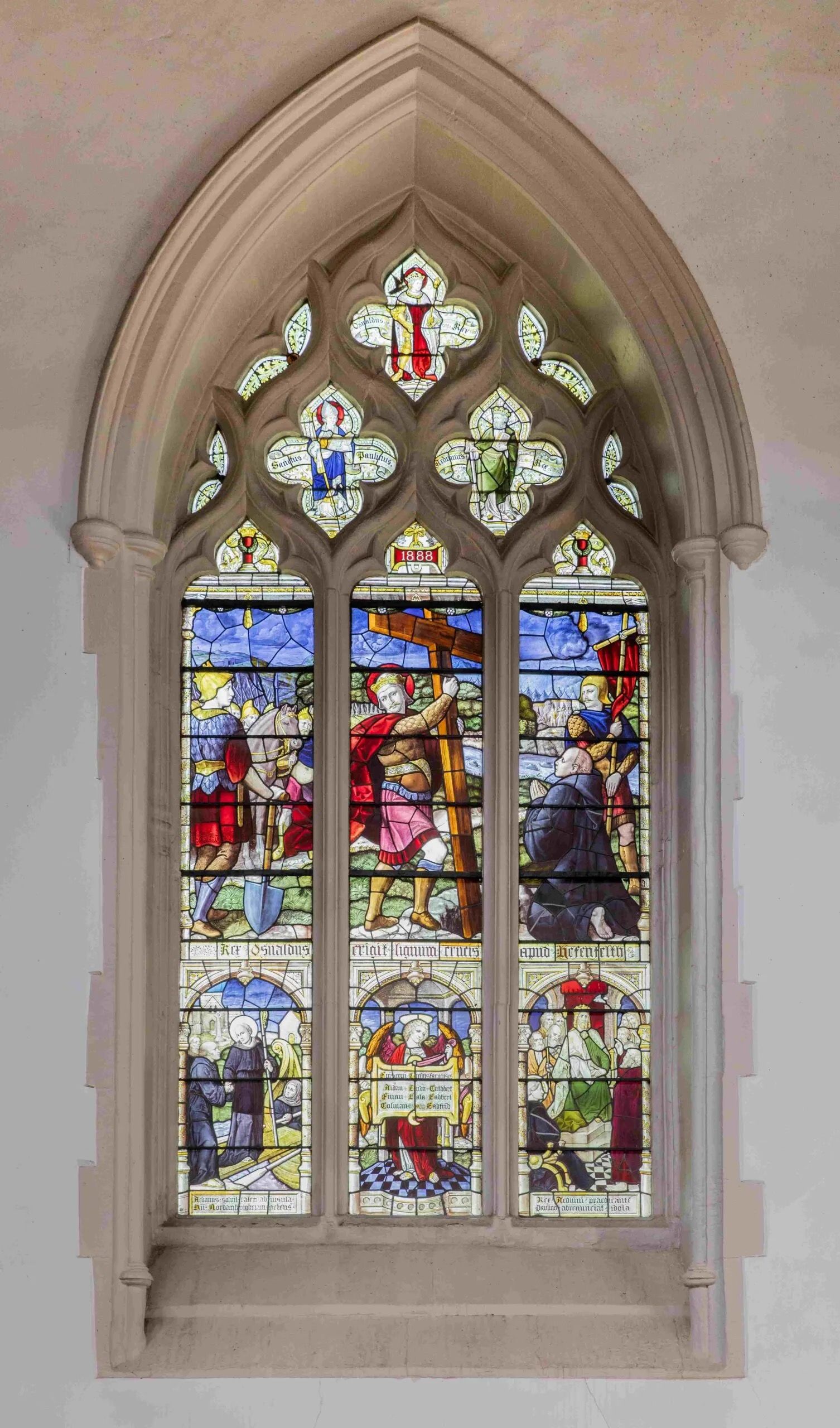 A stained-glass lancet window in the chapel