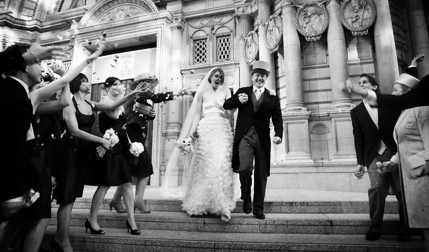 A bride and groom leaving Westminster Cathedral through a line of confetti, Elizabeth Hsieh Make Up Artist, London, England