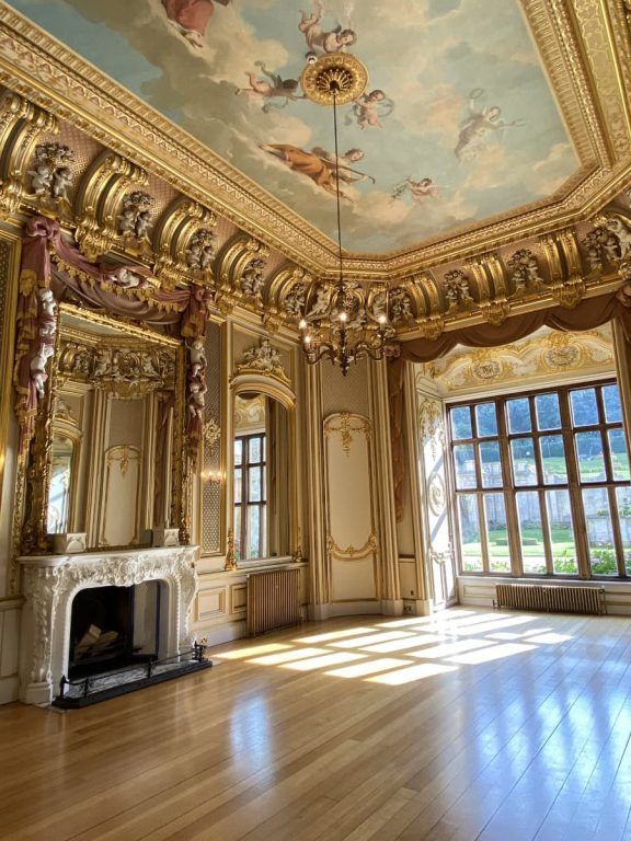 The gilded Gold Room, its painted ceiling above an ornate fireplace and gold ornament