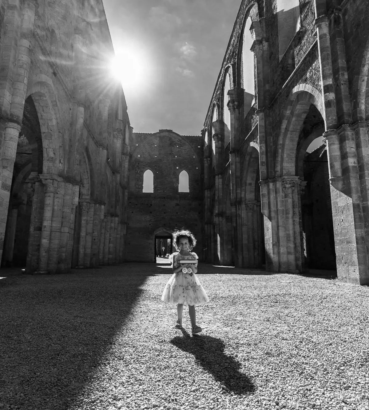 The Abbey of San Galgano, roofless since the fourteenth century, sun through the nave, Simone Perini Photography, Florence, Italy