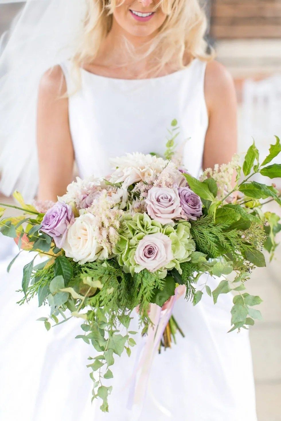 A bridal bouquet of lilac and cream, Gaynes Park, Essex
