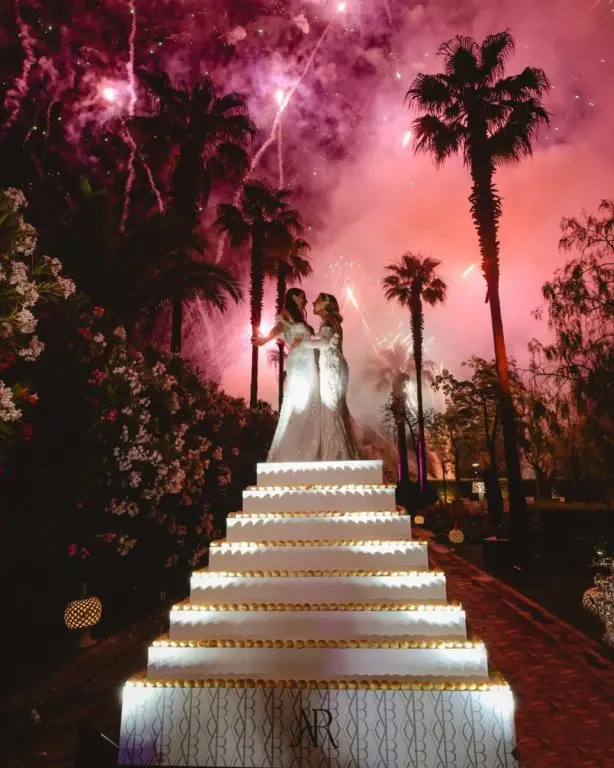 A staircase cake, lit
