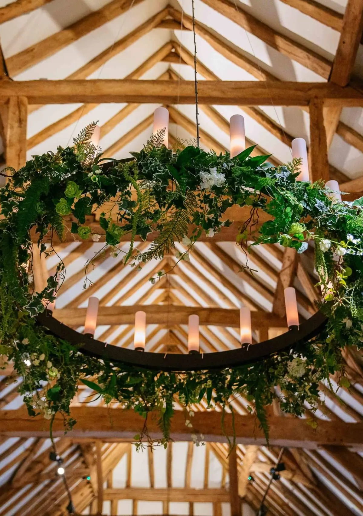 The Great Barn roof, oak trusses with a suspended foliage hoop