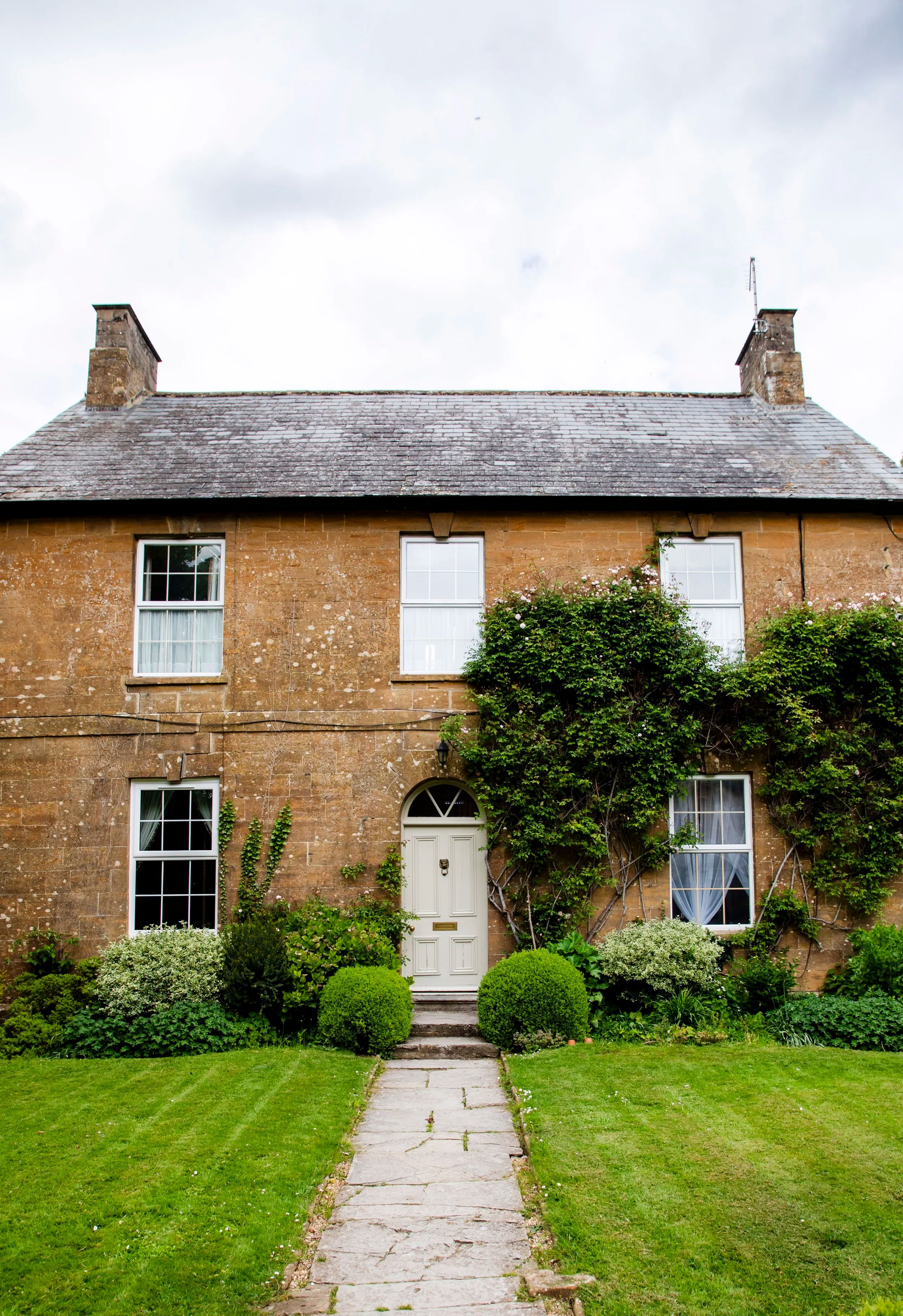 One of the estate's hamstone buildings, honey-coloured in the Somerset light