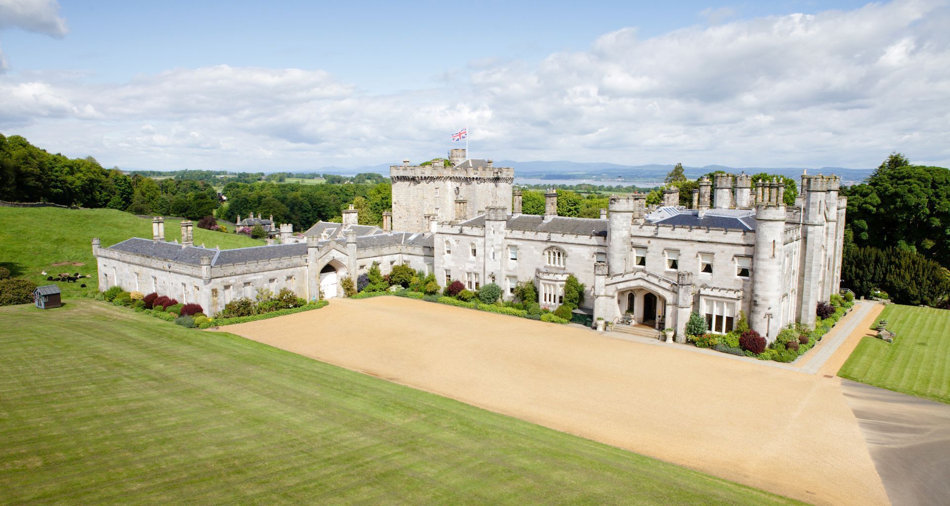 An aerial view of Dundas Castle and its lawns within the private estate, Dundas Castle, South Queensferry, Scotland