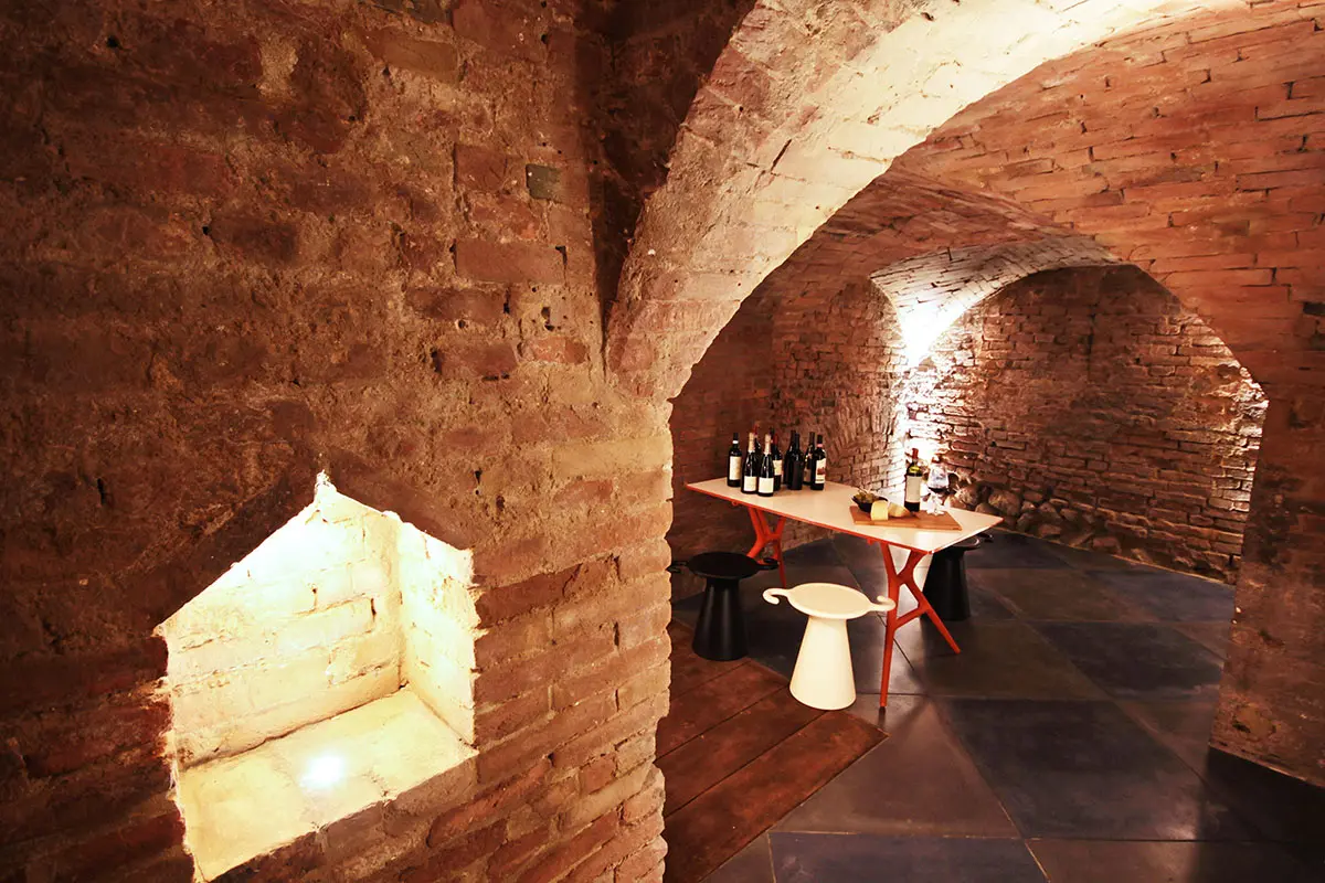 The vaulted brick wine cantina and tasting space
