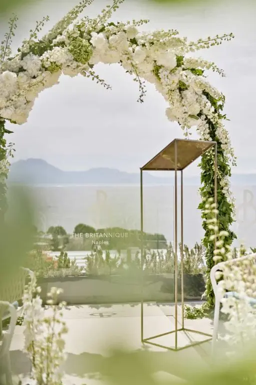 A rooftop ceremony terrace with Vesuvius beyond