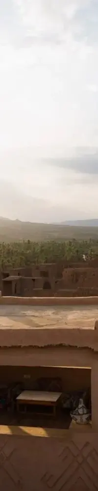 The kasbah above its palm oasis, at golden hour