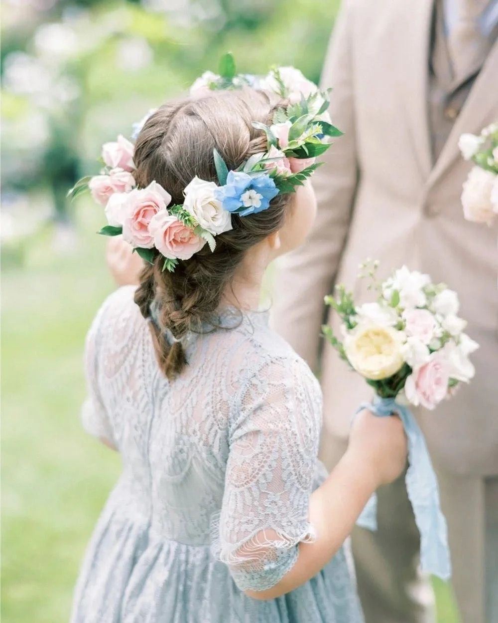 A flower girl's crown of rose, sweet pea and delphinium