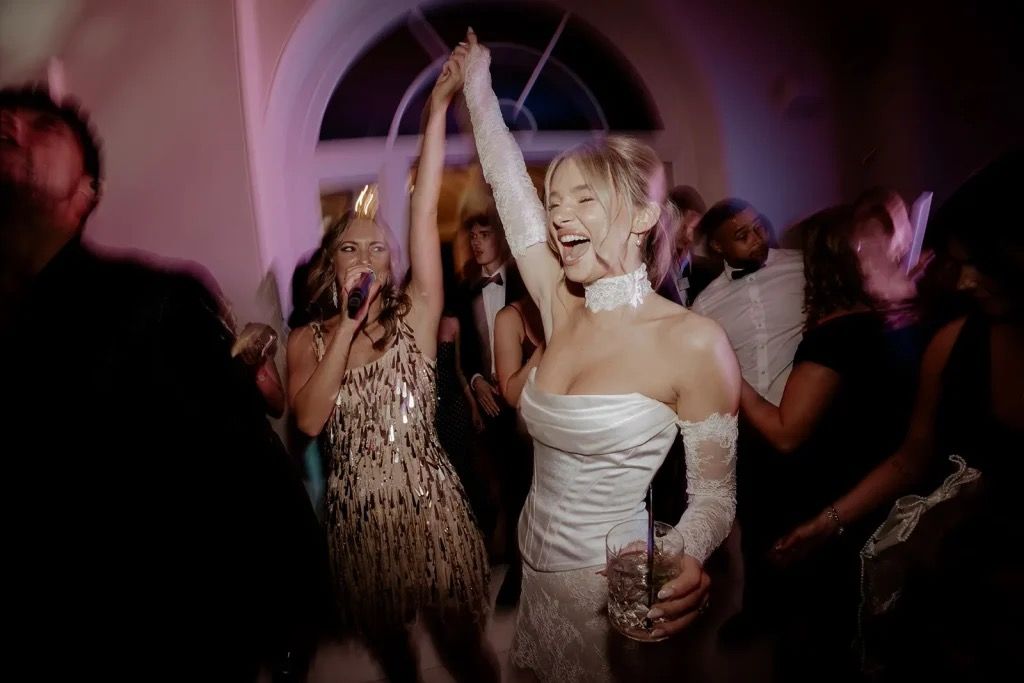 Bride dancing at her wedding with Aston Band