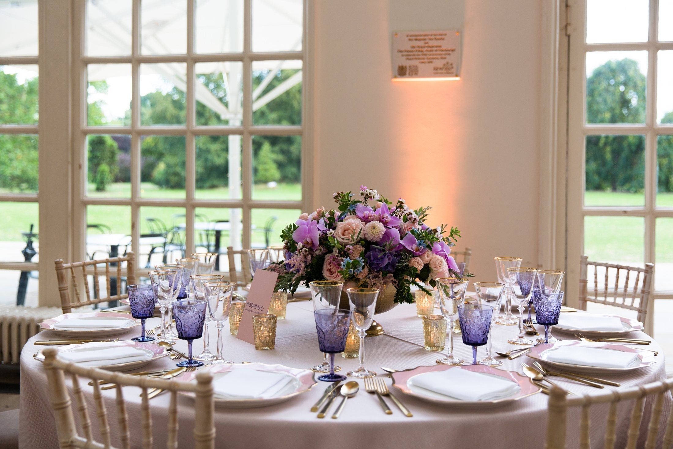 A candlelit wedding table in the Orangery at Kew Gardens