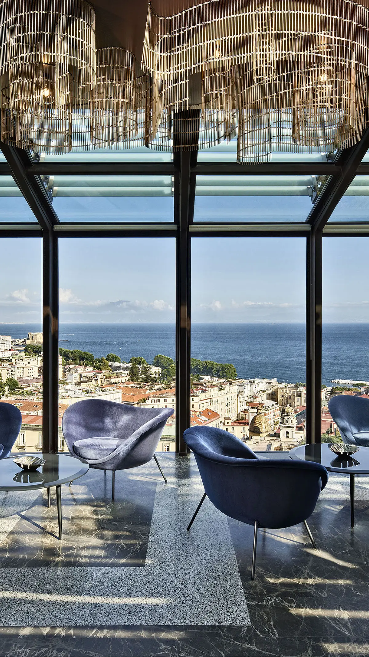 The NIQ rooftop lounge with Vesuvius panorama at The Britannique Naples