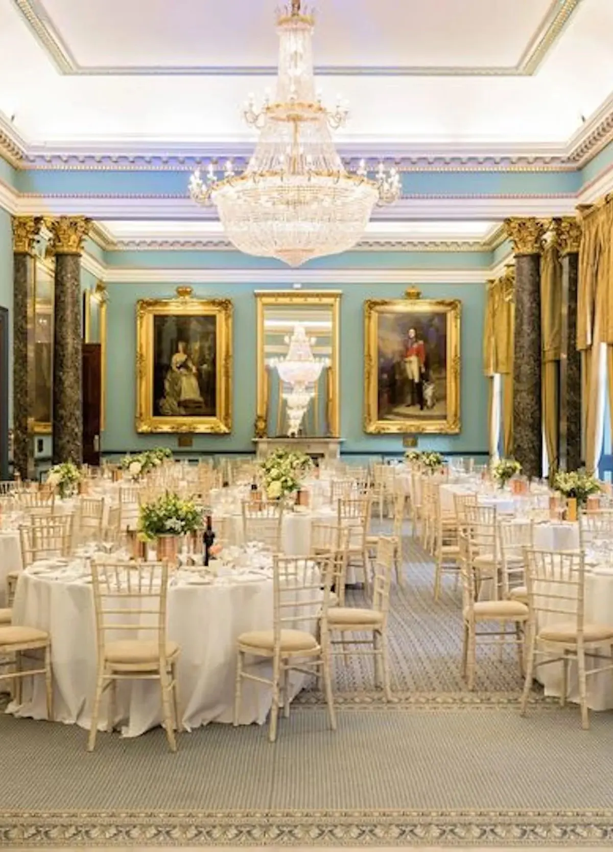 The Nash dressed for a wedding breakfast beneath chandeliers and royal portraits