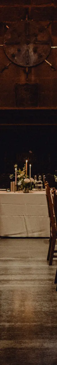 The Great Hall laid for a wedding breakfast beside the fireplace