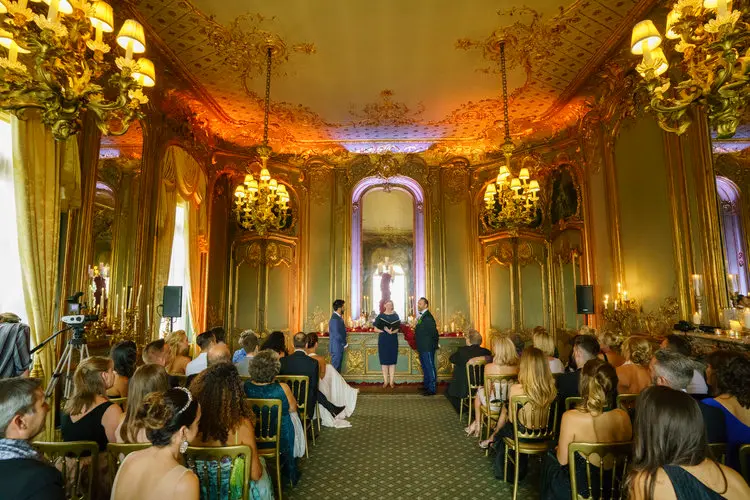 A ceremony in a gilded, mirrored room, In Water Flowers, London, England