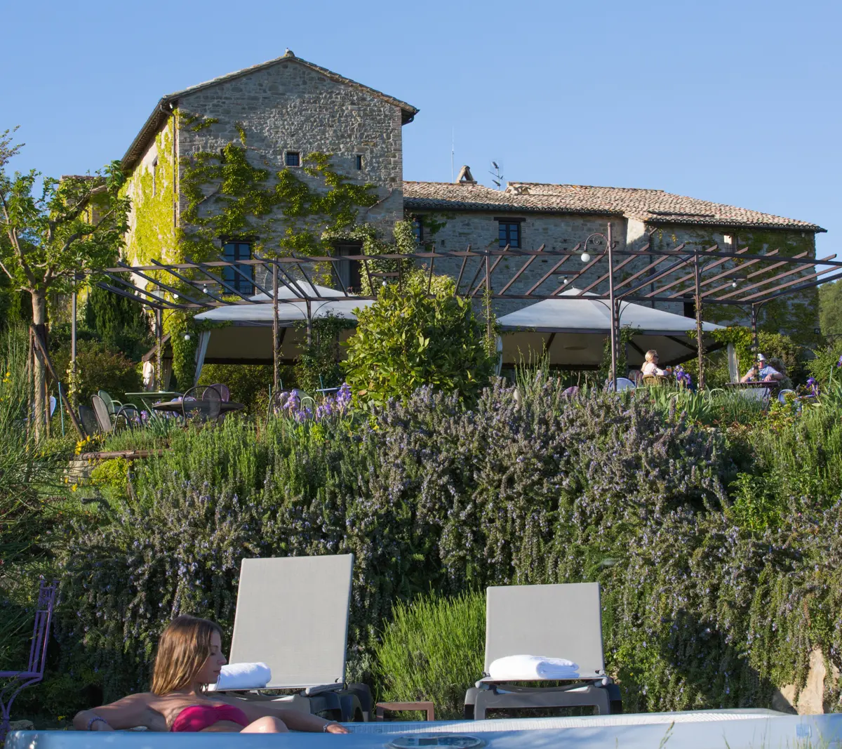 The outdoor jacuzzi at Castello di Petrata with views of Assisi