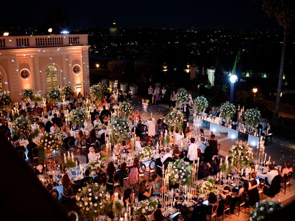 A rooftop reception over Rome at night