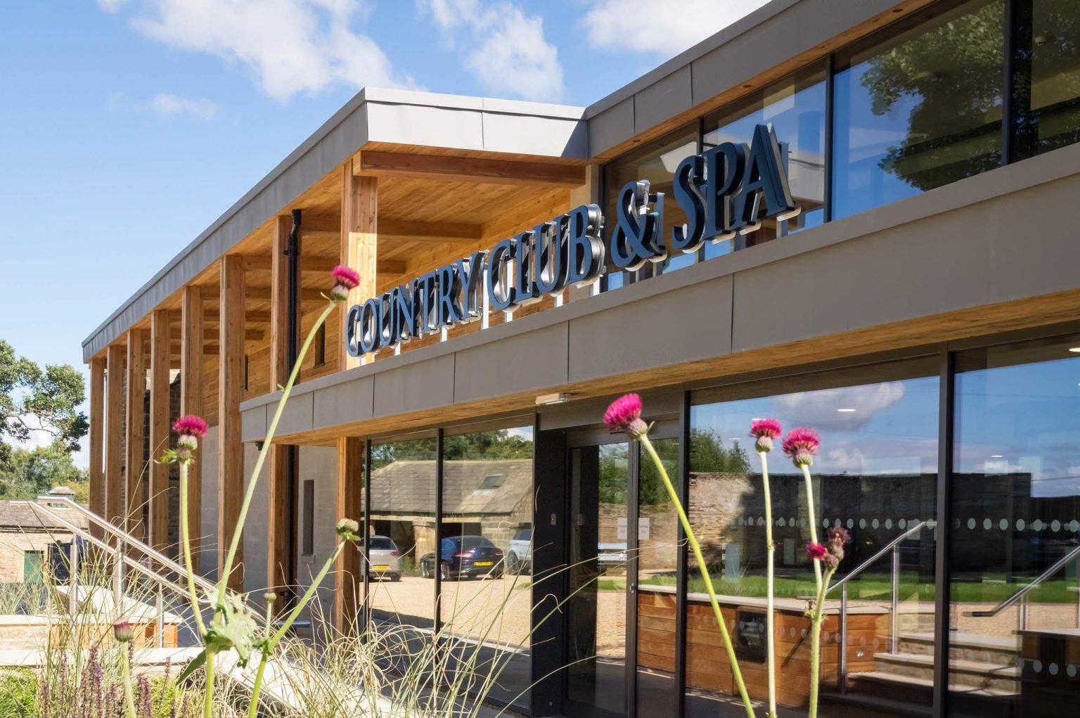 The Country Club and Spa building, timber and glass, on the estate