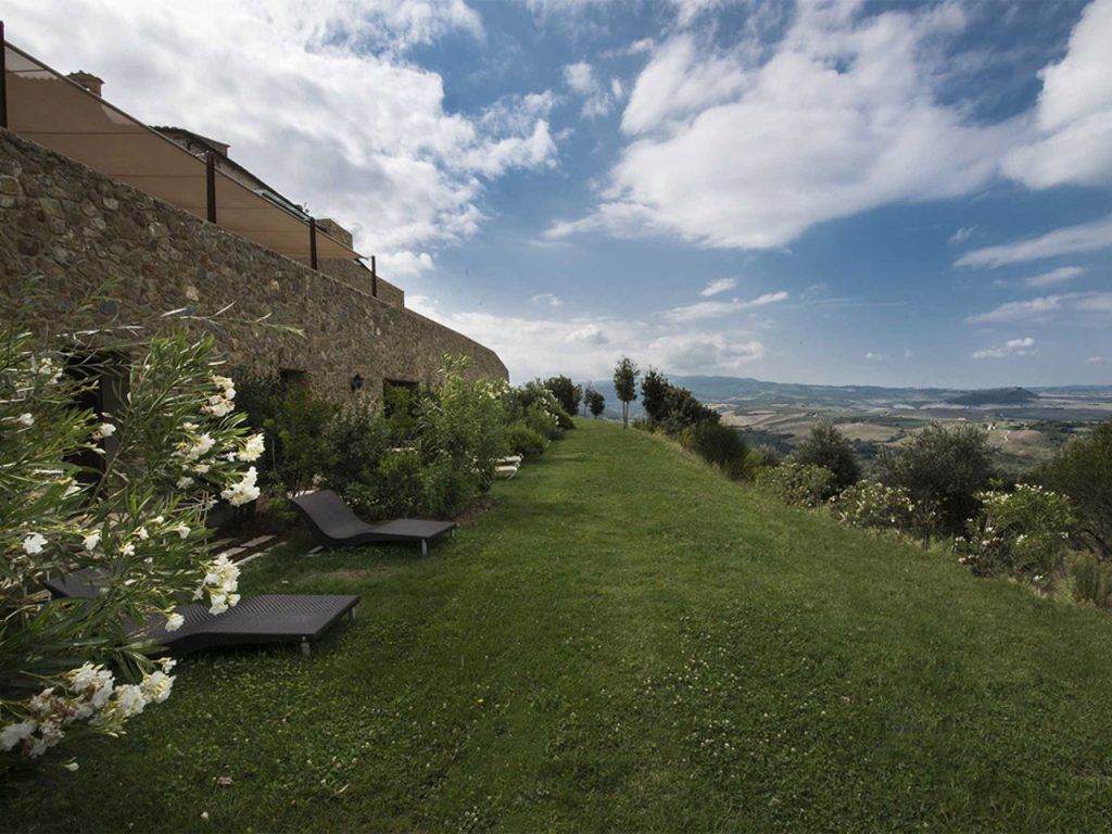 The OLISPA outdoor thermal pool fed by natural mineral springs, Castello di Velona, Val d’Orcia, Tuscany