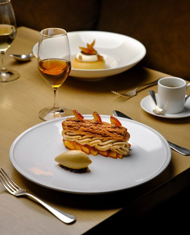 A refined plated dessert course at Berners Tavern, The London EDITION, London, England