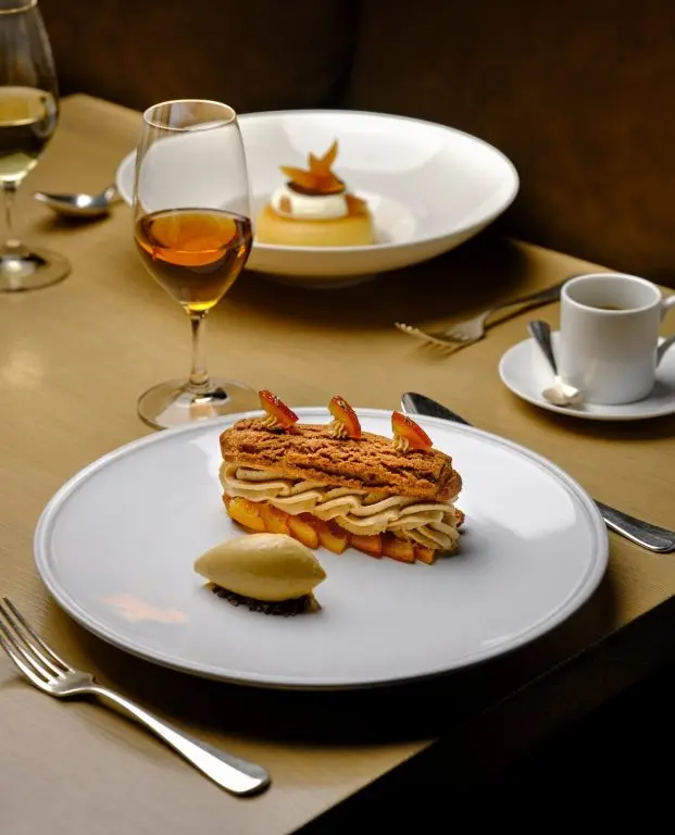 A refined plated dessert course at Berners Tavern, The London EDITION, London, England