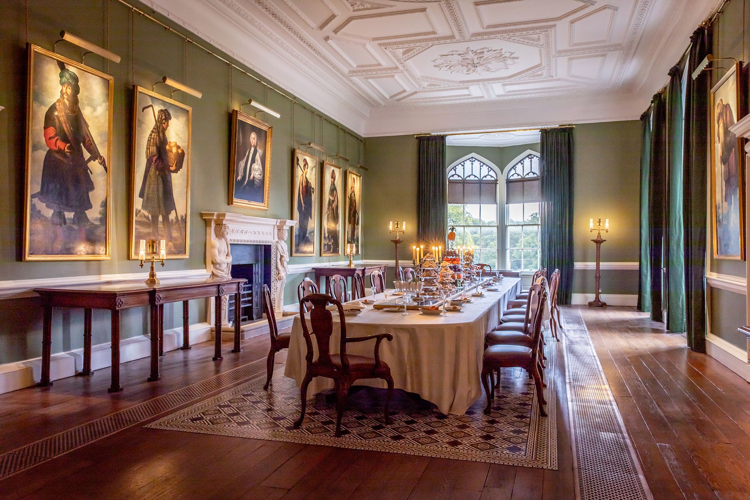 The Long Dining Room set for a candlelit private dinner, Zurbaran portraits above the panelling, Auckland Castle, Bishop Auckland, England