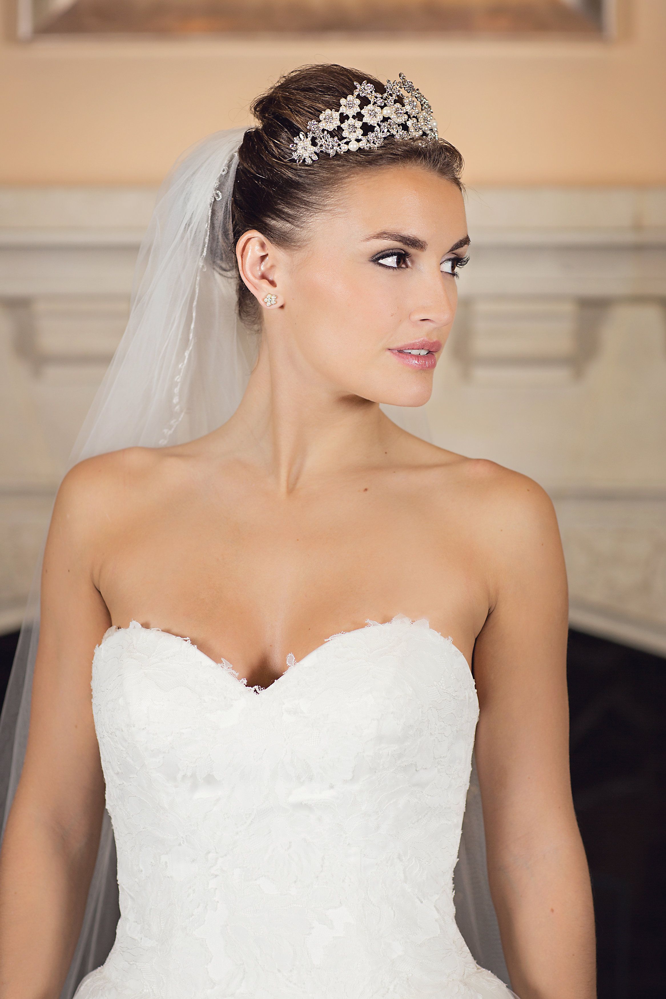 A bridal portrait in a crystal star tiara, sweetheart-neckline lace gown, Nadine Pyke Make Up Artist, Surrey, England