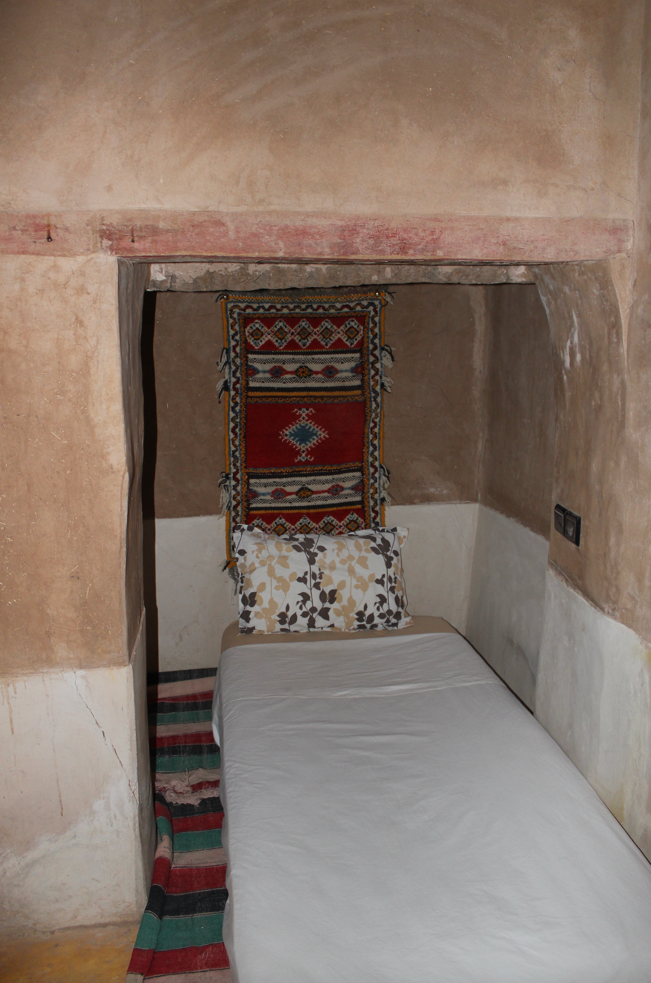 A room within the kasbah walls, in earth and rug, Kasbah des Caïds, Agdz, Morocco