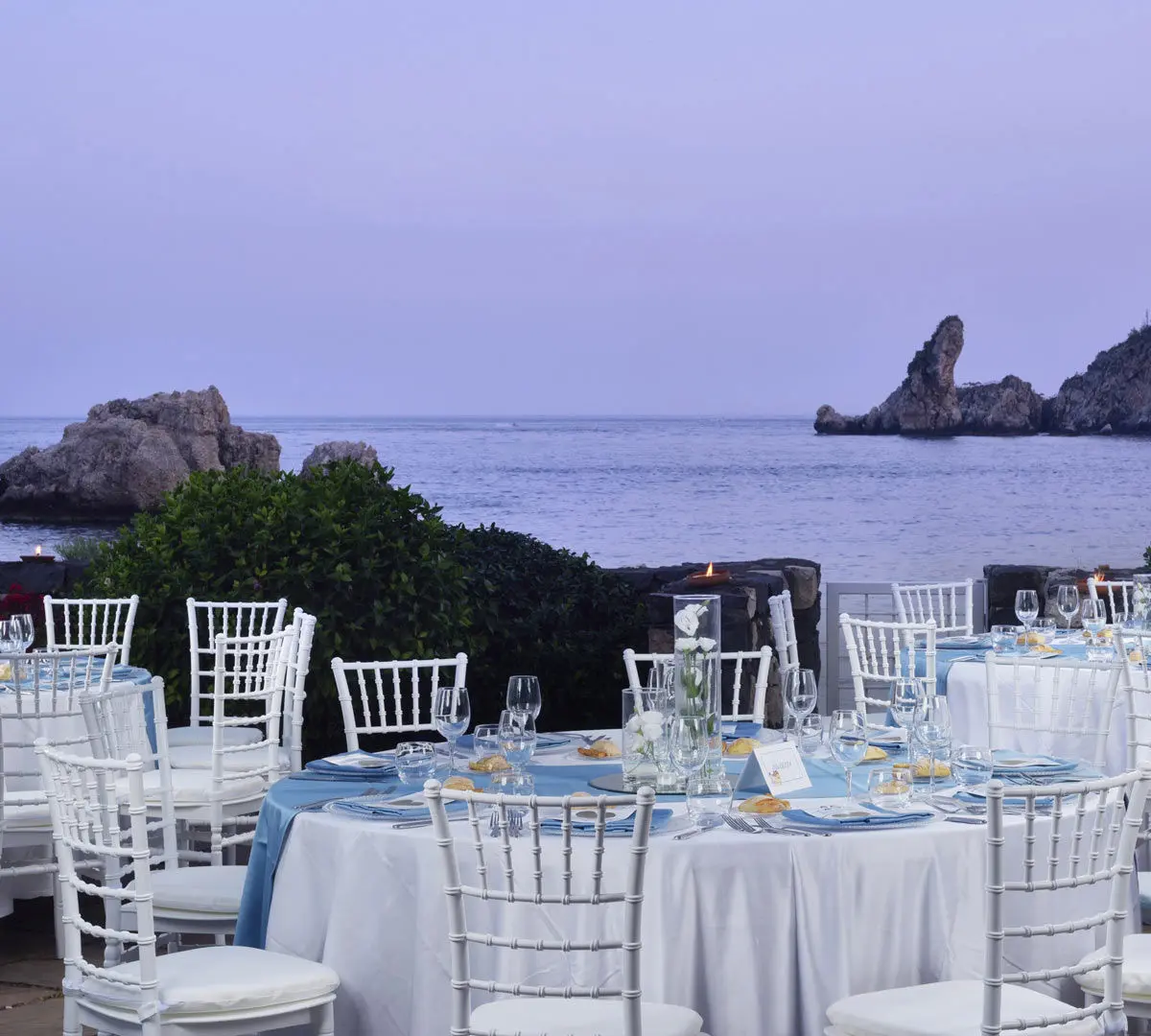 A Sicilian risotto plated at the beach club, Isola Bella behind