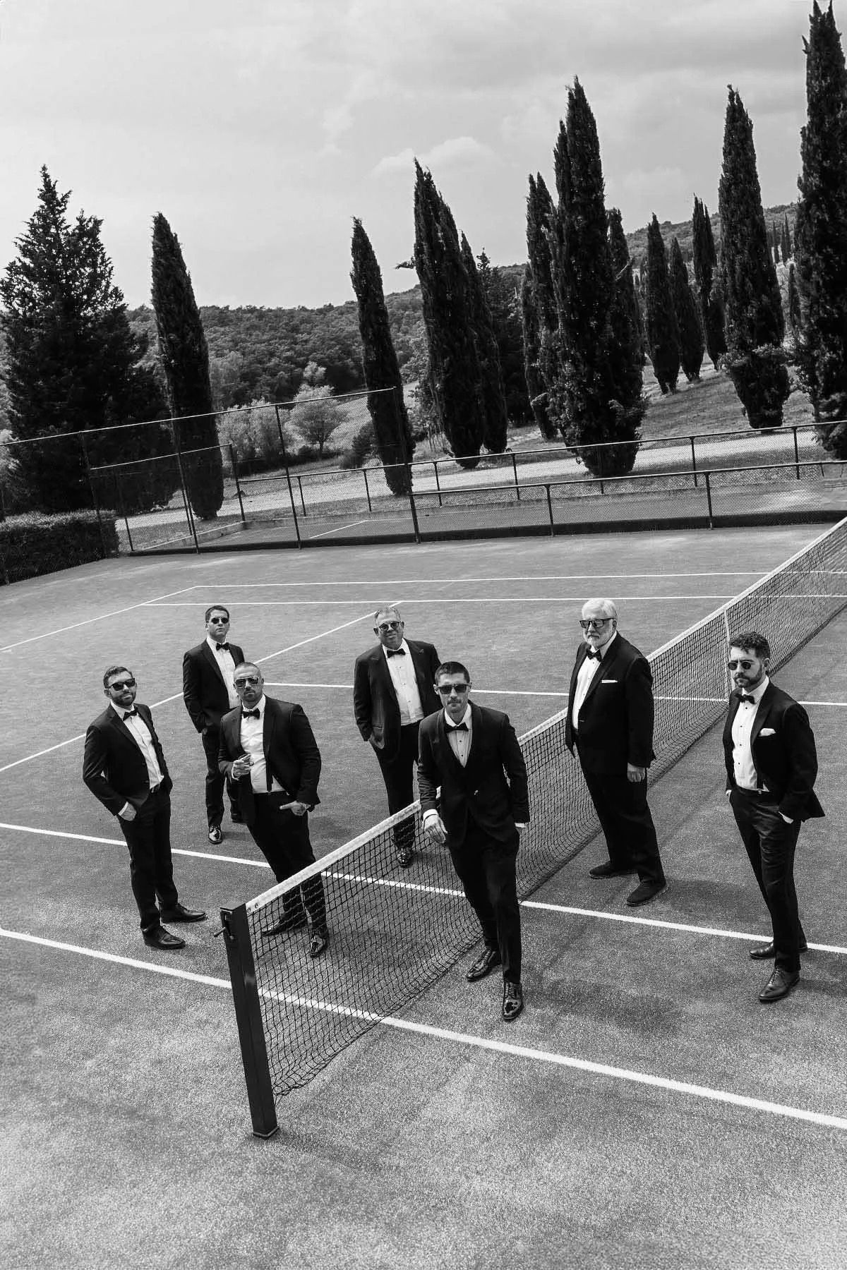 The groomsmen, on the tennis court