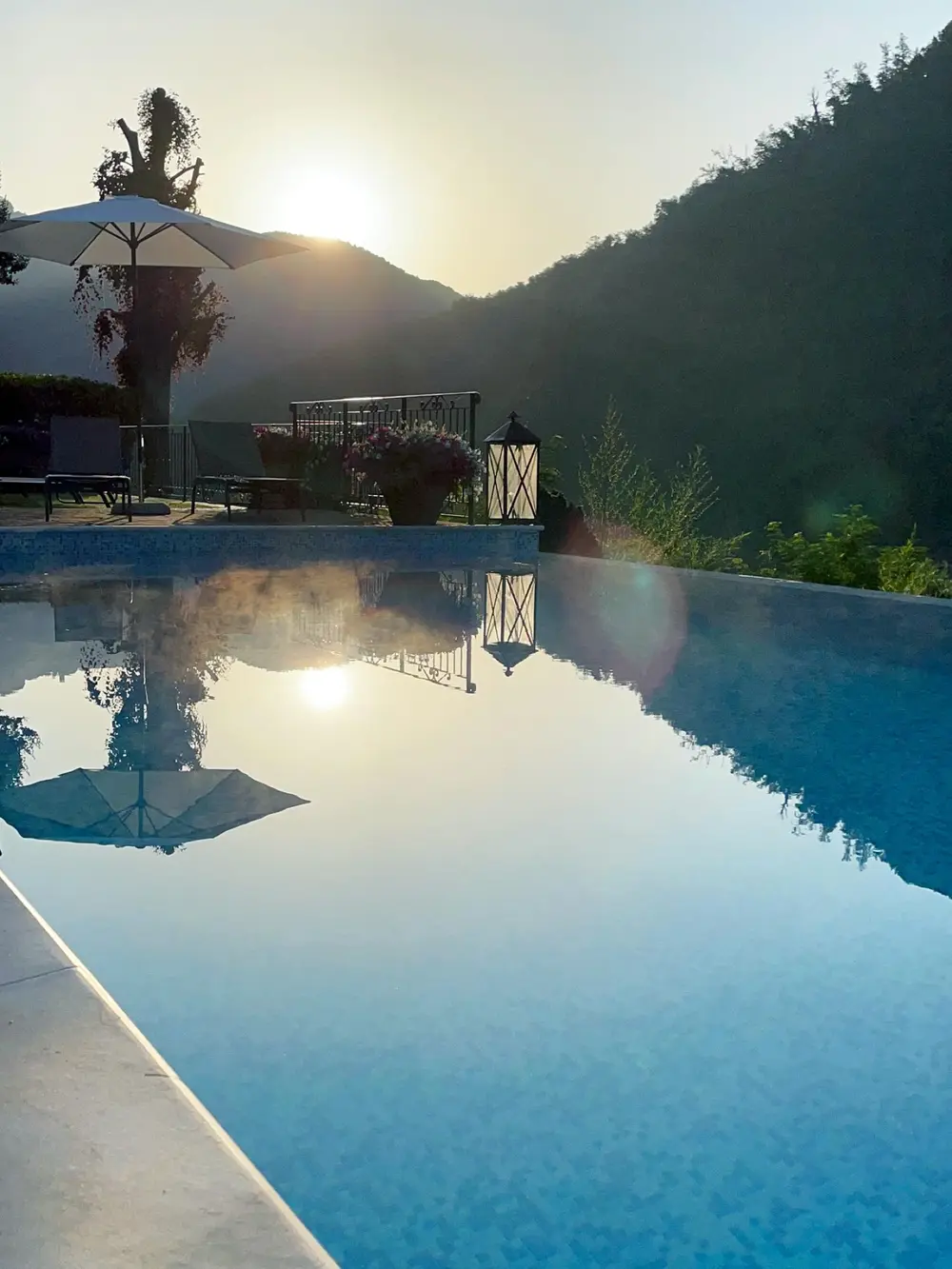 The pool at dusk, the hills reflected in the water