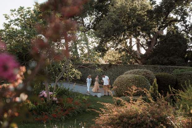 Eco-gardens and clipped hedges running toward the beach