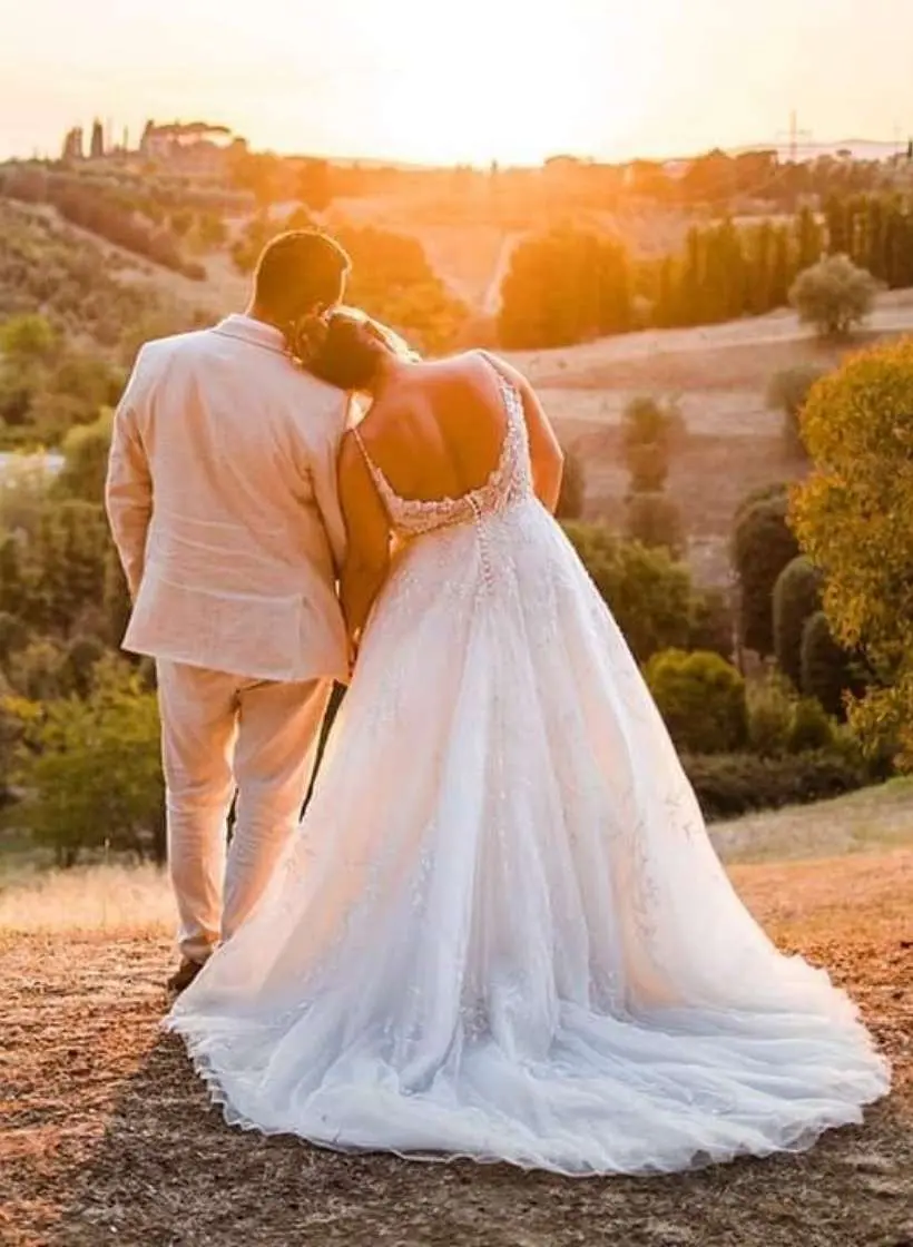 A couple at sunset over the Tuscan hills