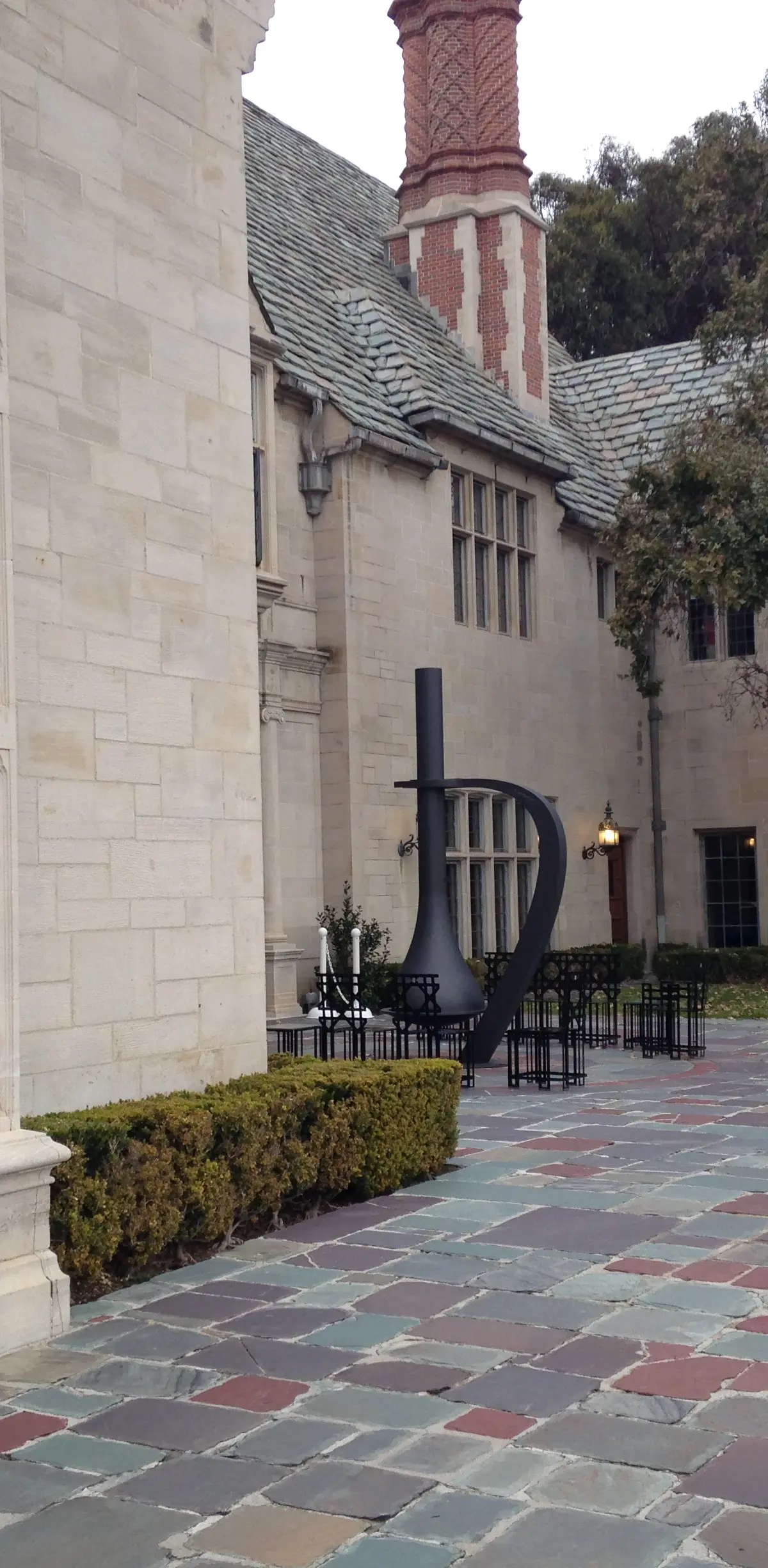 The West Courtyard terrace at Greystone Mansion, with the Los Angeles skyline beyond