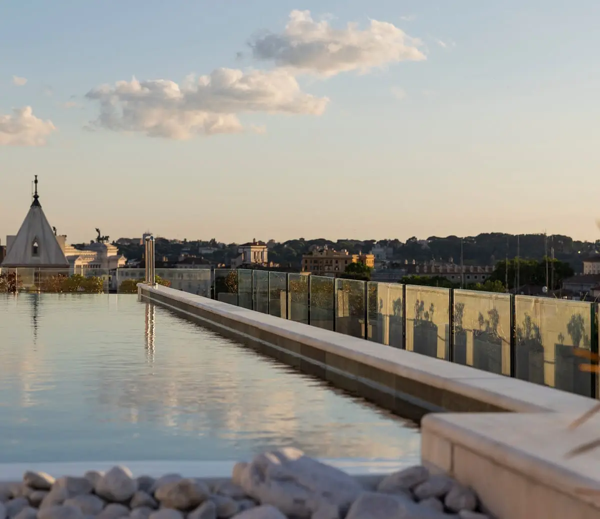 The rooftop pool at dusk, Anantara Palazzo Naiadi Rome