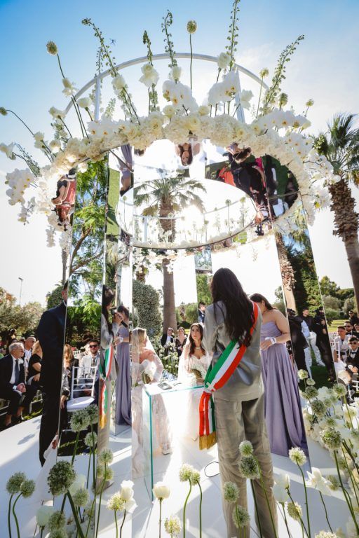 Under the floral canopy, the register signed
