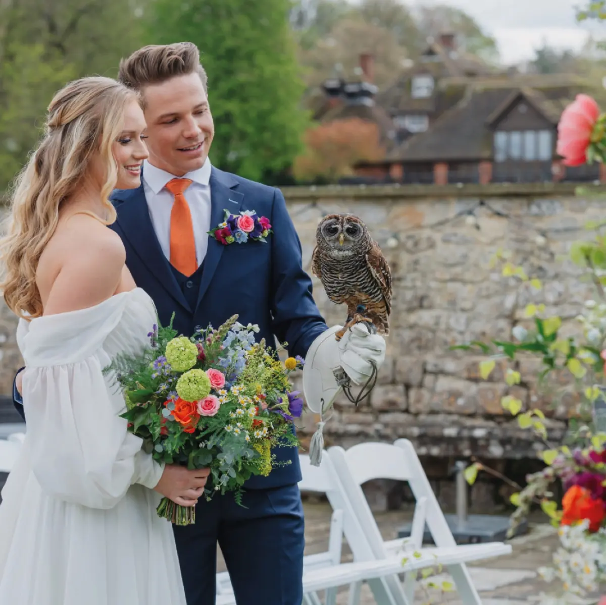 A wedding couple before Leeds Castle
