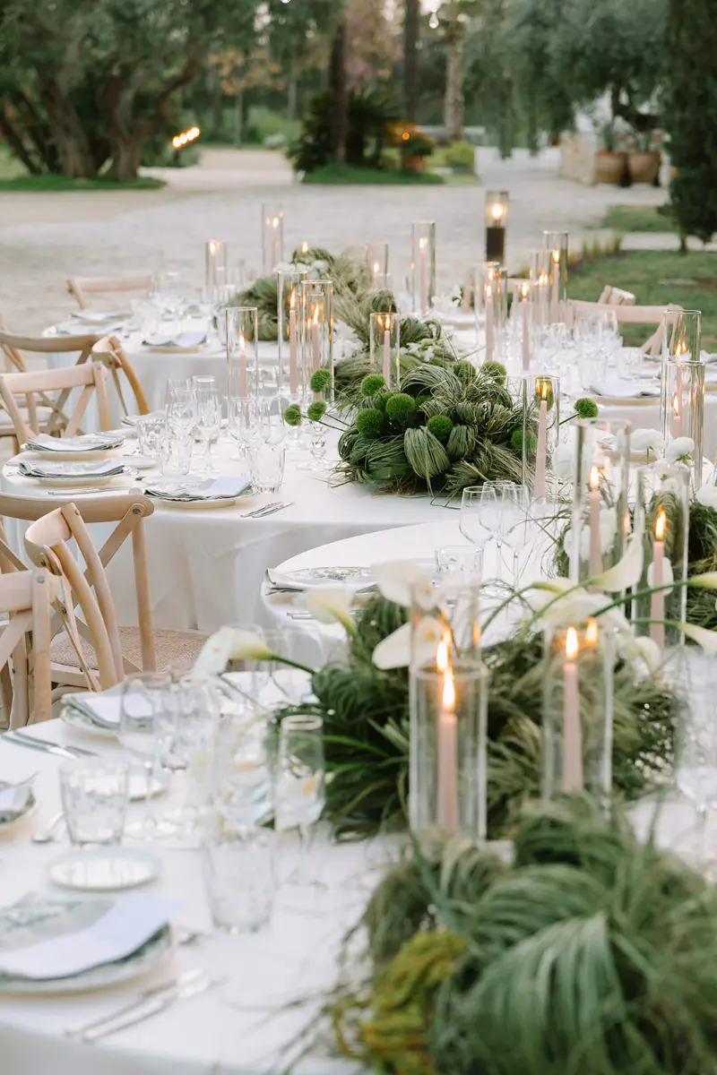 Candlelit table setting with white flowers