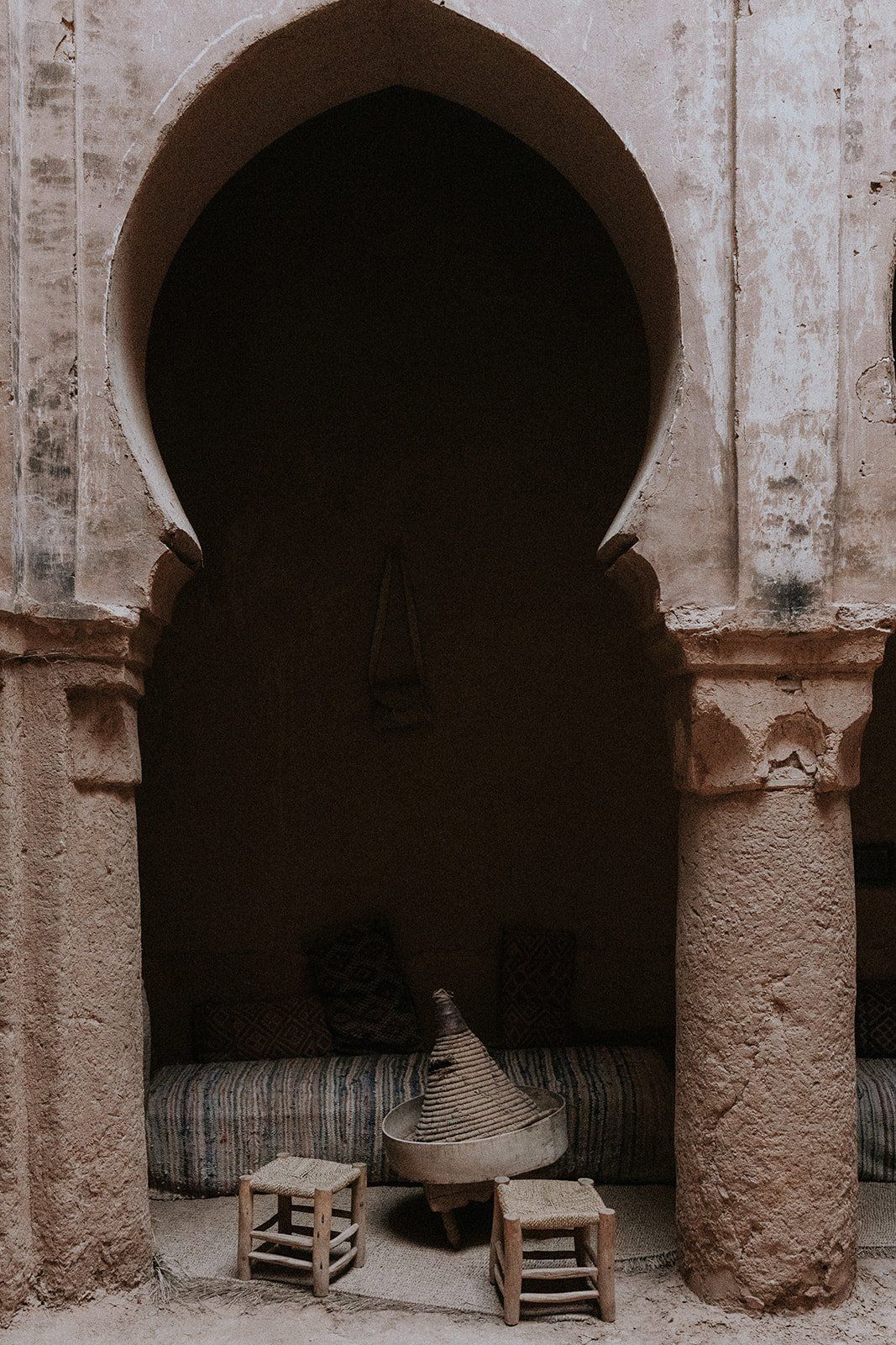 A keyhole arch and a lantern-lit doorway