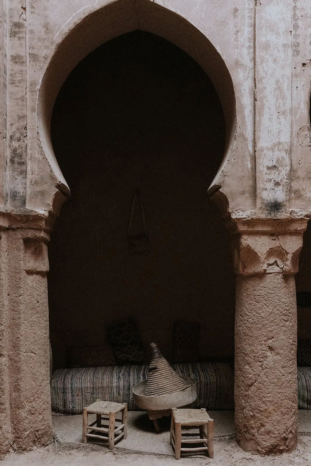 A keyhole arch and a lantern-lit doorway