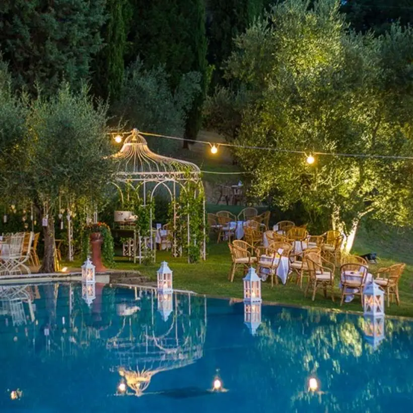 A wedding ceremony in the park at Villa Il Patriarca