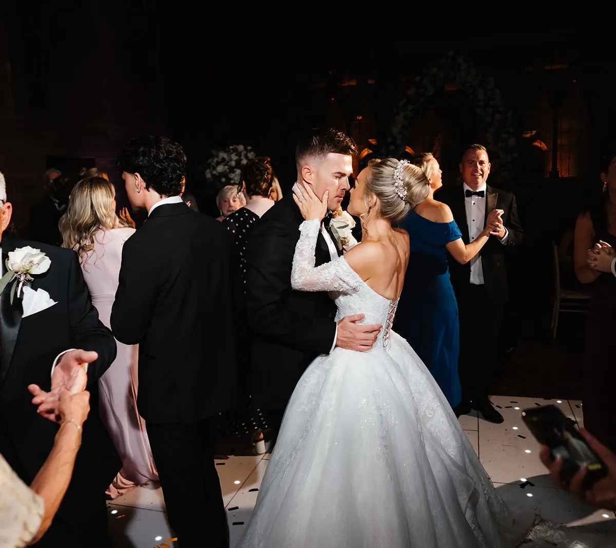 The couple's first dance on a sparkling dancefloor at night