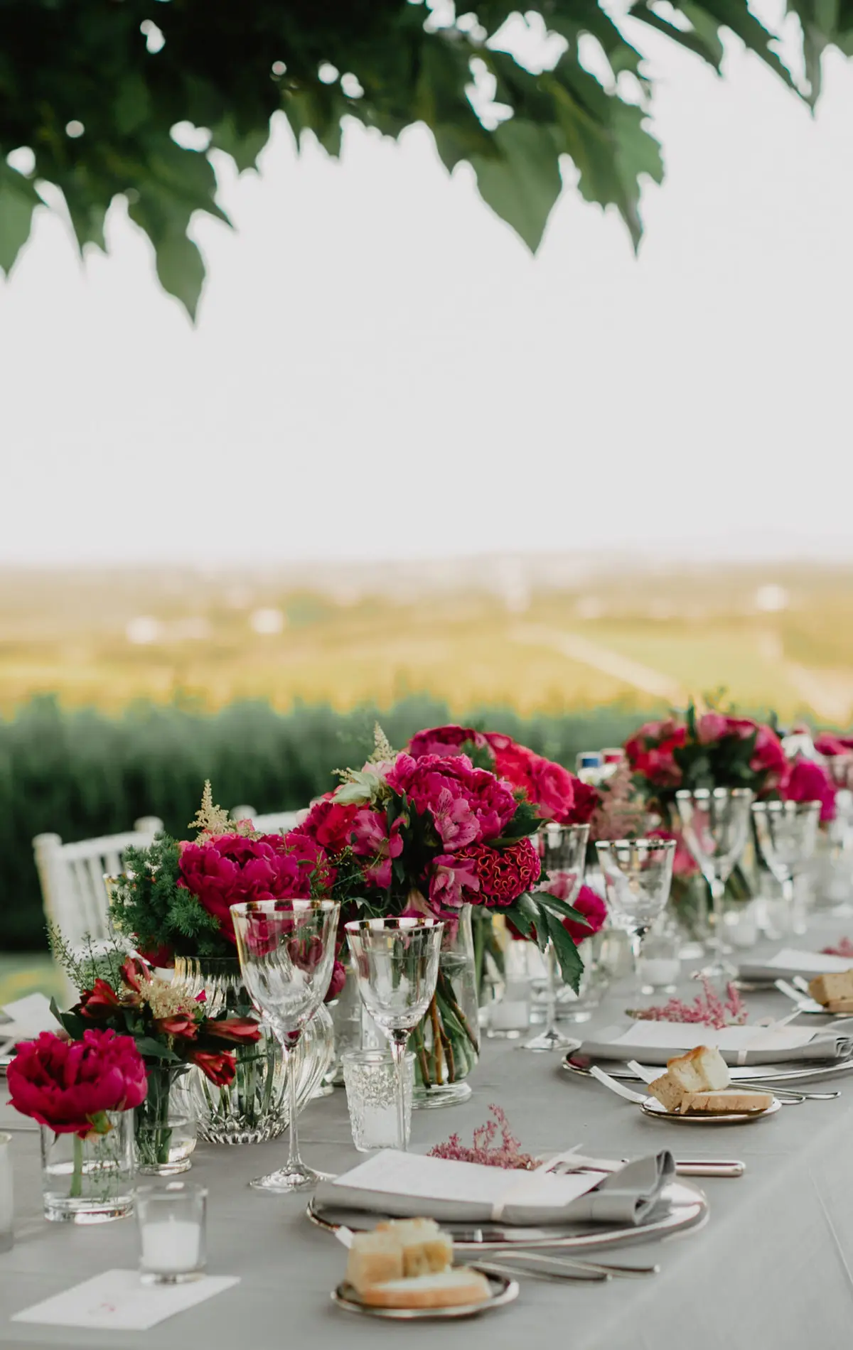 A wedding table with red peonies at Hotel Le Fontanelle