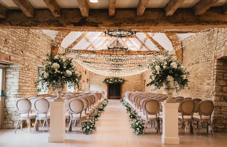The ceremony aisle inside one of the barns at Caswell House