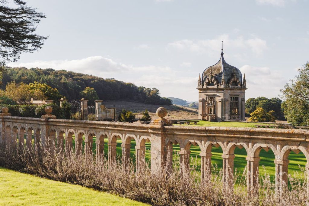The Baroque garden's ornamental stone pavilion set against the Lincolnshire vale