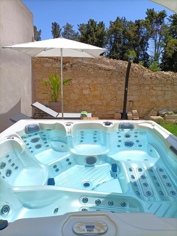 Close on the hot tub, the water lit an inviting blue