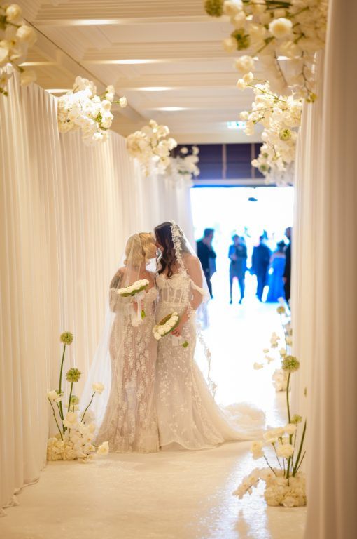 A white corridor of orchids, and the walk through it